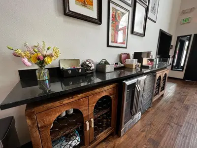 a room with a counter with a vase of flowers on it at Hotel Frisco in Frisco