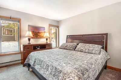 a bedroom with a bed and a window at Pines Foxtail 2046 in Keystone