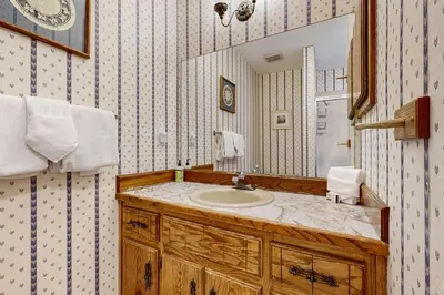 a bathroom with a sink and a mirror at Alpine Abode in Frisco