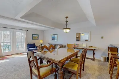 a dining room with a table and chairs at Alpine Abode in Frisco