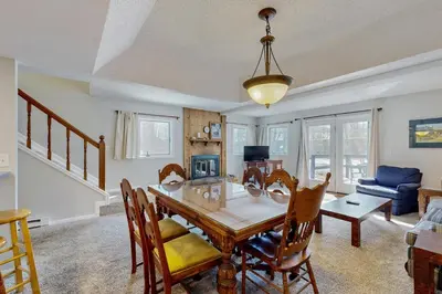 a dining room with a table and chairs at Alpine Abode in Frisco