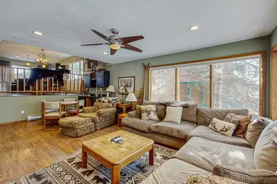 a living room with a couch and a table at Rivercrest 1 in Frisco
