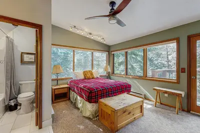 a bedroom with a bed and a bathroom at Rivercrest 1 in Frisco