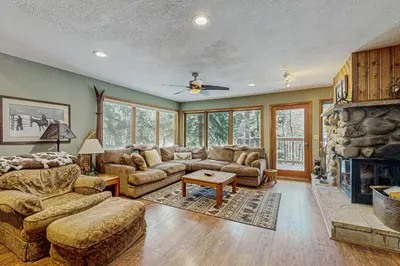 a living room with a couch and a fireplace at Rivercrest 1 in Frisco