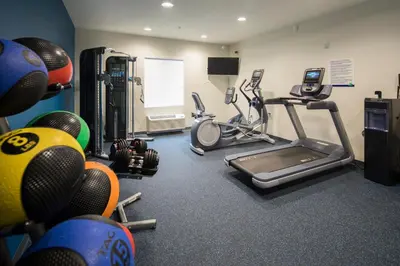 a fitness room with a gym with exercise equipment at Uptown Suites Extended Stay Denver CO -Westminster in Westminster