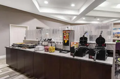 a kitchen with a counter with food on it at La Quinta by Wyndham Denver Boulder - Louisville in Louisville