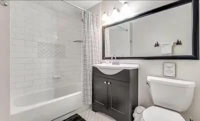 a bathroom with a sink and a toilet and a bath tub at Forest Feeling in Dillon
