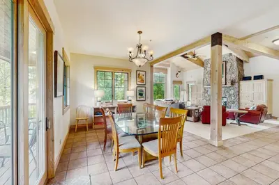a dining room and living room with a table and chairs at Easy Bend Elegance in Silverthorne