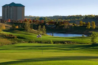 a golf course with a green and a pond at Omni Interlocken Hotel in Broomfield