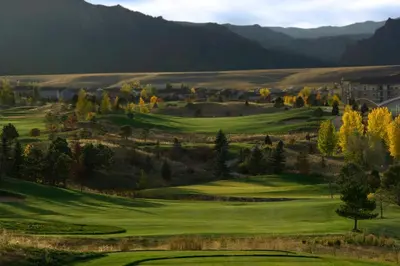 a view of a golf course with mountains in the background at Omni Interlocken Hotel in Broomfield