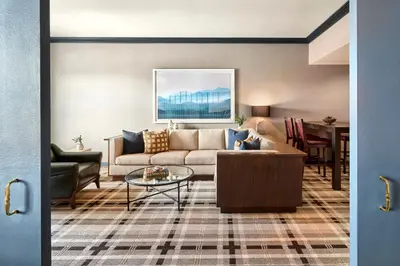 a living room with a couch and a table at Omni Interlocken Hotel in Broomfield