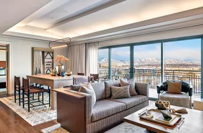 a living room with a couch and a table at Omni Interlocken Hotel in Broomfield