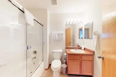 a bathroom with a toilet and a sink and a shower at Gore Trail Getaway in Silverthorne