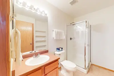 a bathroom with a toilet and a sink and a shower at Gore Trail Getaway in Silverthorne