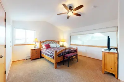 a bedroom with a bed and a ceiling fan at Gore Trail Getaway in Silverthorne