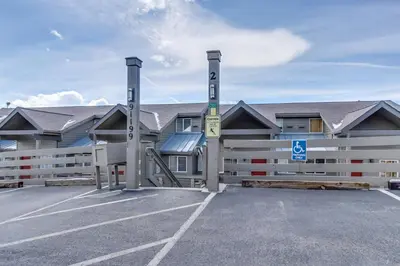 a building with a parking lot in front of it at Gore Trail Getaway in Silverthorne