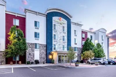 a rendering of a hotel in a parking lot at Candlewood Suites Denver Northeast - Brighton by IHG in Brighton