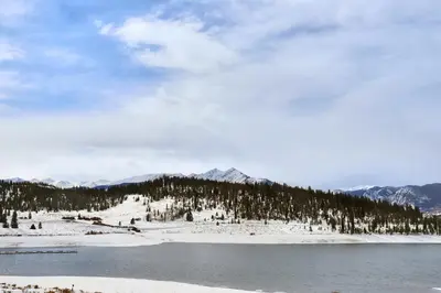 a view of a snow covered mountain with a lake at 303D Dillon Bay Condo Condo in Dillon