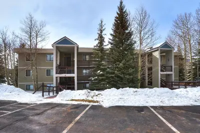 a building with a lot of snow in front of it at 303D Dillon Bay Condo Condo in Dillon