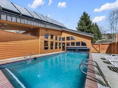 a swimming pool in front of a building at 303D Dillon Bay Condo Condo in Dillon