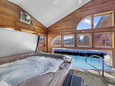 a large tub in a room with a fireplace at 303D Dillon Bay Condo Condo in Dillon