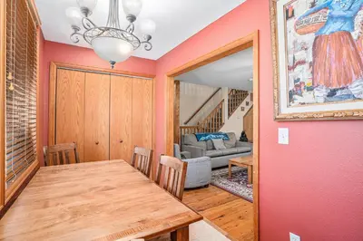 a dining room with a table and a couch at Elk Haven in Estes Park