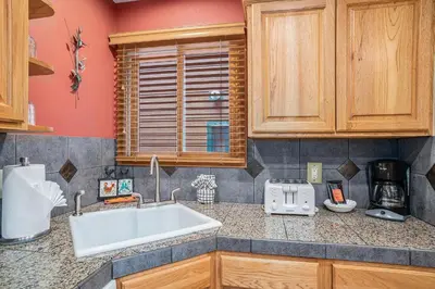 a kitchen with a sink and a counter top at Elk Haven in Estes Park
