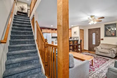 a staircase in a home with a living room at Elk Haven in Estes Park