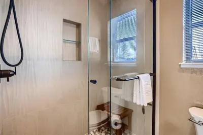 a bathroom with a glass shower with a toilet at Mountainside 753 Home in Frisco