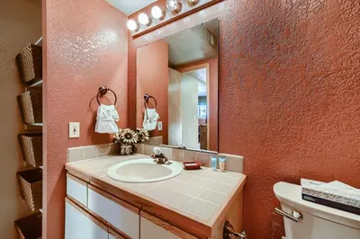a bathroom with a sink and a mirror at Mountainside 753 Home in Frisco