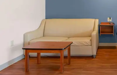 a living room with a couch and a coffee table at Extended Stay America Suites - Denver - Airport in Aurora