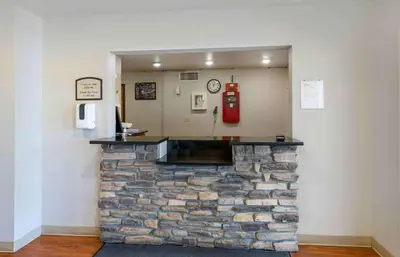a stone bar with a fire hydrant on a wall at Extended Stay America Suites - Denver - Airport in Aurora
