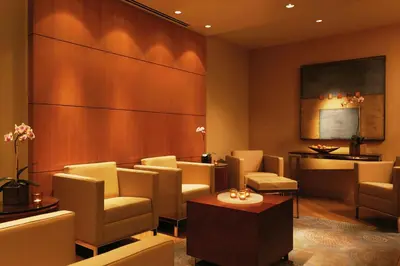 a waiting room with chairs and a table at Four Seasons Hotel Denver in Denver