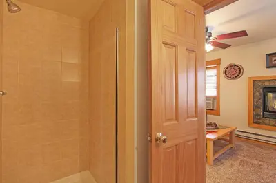a bathroom with a walk in shower and a walk in shower at Little Matterhorn 17A Condo in Estes Park