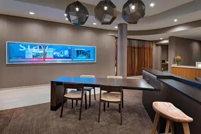 a dining room with a table and chairs at SpringHill Suites by Marriott Denver West/Golden in Lakewood