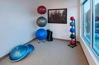 a room with balloons and blue chairs and a window at SpringHill Suites by Marriott Denver West/Golden in Lakewood