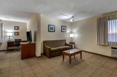 a living room with a couch and a television at Comfort Inn Denver Southeast Area in Aurora