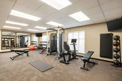 a gym with several treadmills and exercise equipment at Residence Inn Denver Cherry Creek in Denver