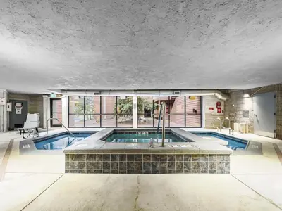 a swimming pool in a large room with a ceiling at 112 Marina Place Condo in Dillon