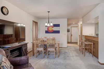 a kitchen and dining room with a table and chairs at 112 Marina Place Condo in Dillon