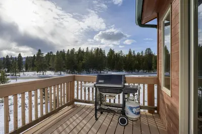 a grill on the deck of a house at Mountain Peak Home in Tabernash