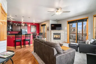 a living room with a couch and a fireplace at Nakai Peak 41B Condo in Estes Park