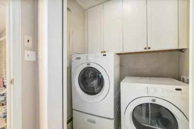 a white washer and dryer in a small kitchen at Starlight In The Rockies in Estes Park