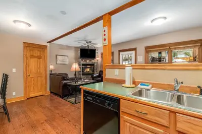a kitchen with a sink and a stove at Hallett Peak 101 Condo in Estes Park