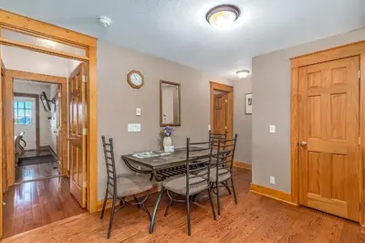 a dining room with a table and chairs at Hallett Peak 101 Condo in Estes Park