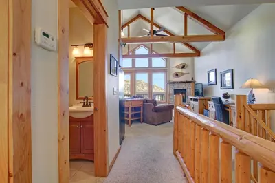 a kitchen and living room with a sink and a counter at Nisa Mountain 36 Condo in Estes Park
