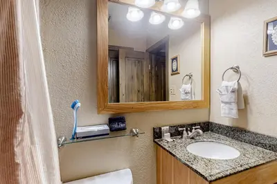 a bathroom with a sink and a mirror at Mountainside D257 in Frisco