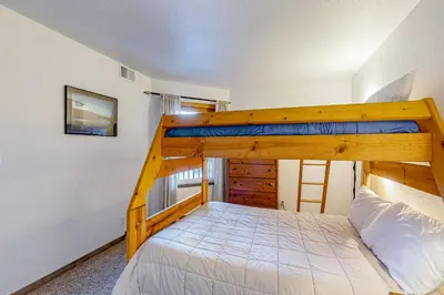 a bedroom with a bunk bed in a room at Mountainside D257 in Frisco