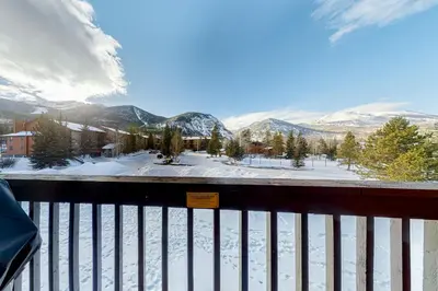 a view of a snow covered mountain from a balcony at Mountainside D257 in Frisco