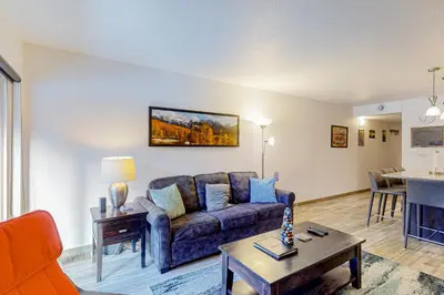 a living room with a couch and a table at Mountainside D257 in Frisco